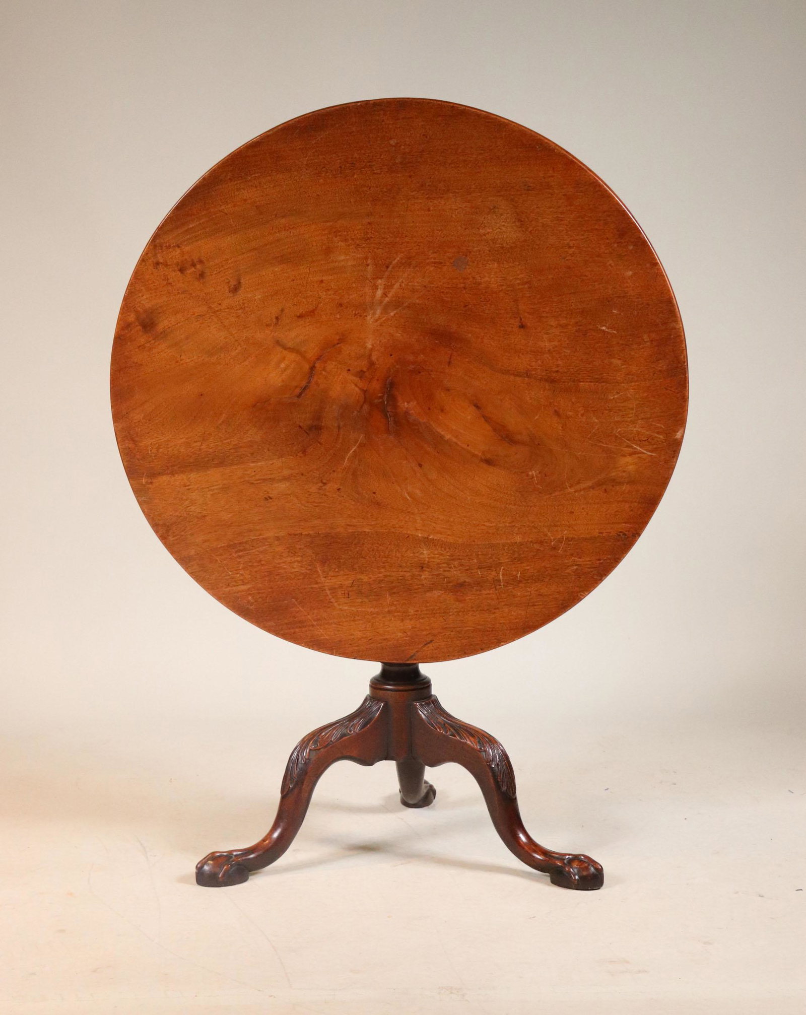 George III Carved Mahogany Tilt-Top Tea Table: Possibly Irish, Mid-18th C. 28"h x 33-1/2"dia. Provenance: Property from the Estate of Robert K. Johnson of Maine and South Carolina