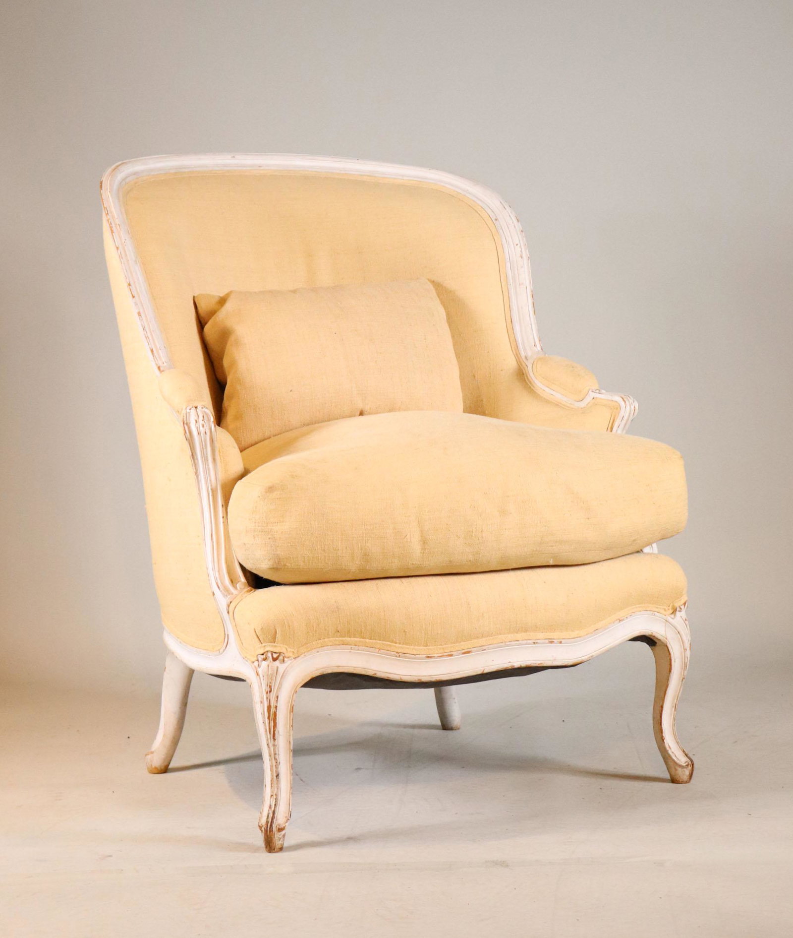 Louis XV Style White-Painted Bergere: French Taste, 20th C. 42"h x 31"w overall, 26"d seat depth Provenance: Property from the Estate of William Hodgins, Boston, Massachusetts