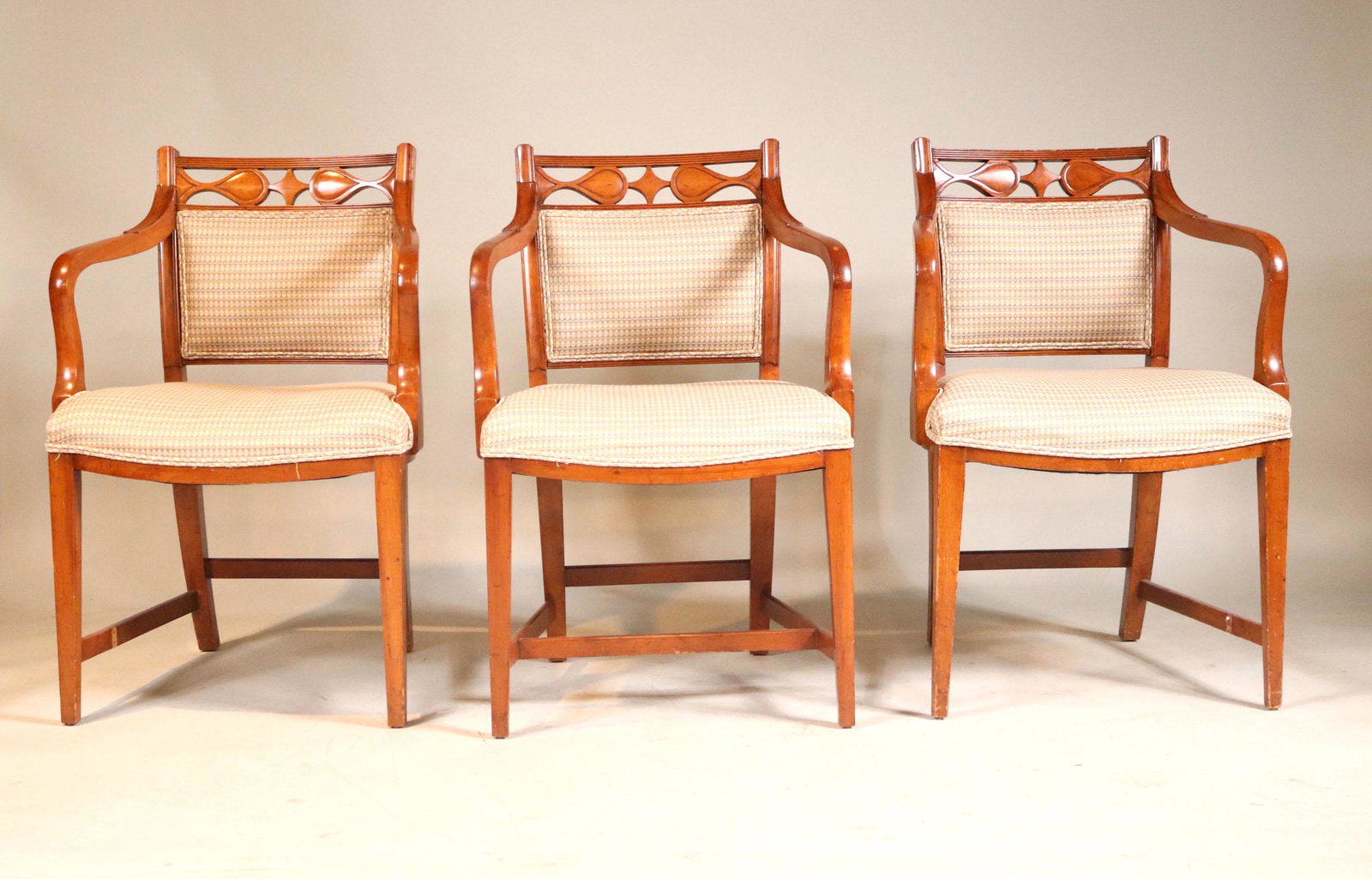 Three Carved Cherrywood Upholstered Armchairs: 20th C. Repairs, surface distress. 34"h x 22-1/2"w x 18"d (seat)