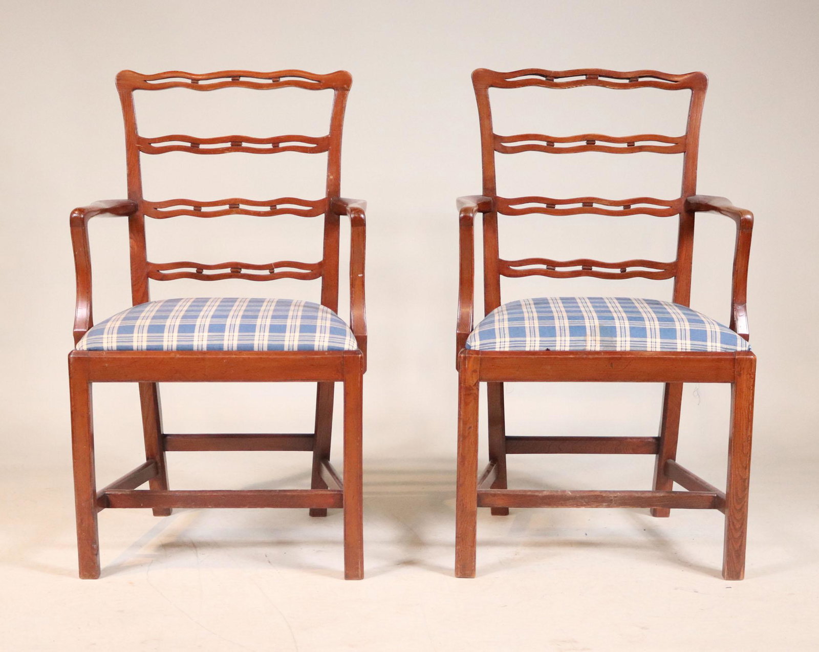 Pair of Chippendale Red Stained Open Armchairs: Probably American, Cherrywood and Ash 37"h x 22"w (over arms) x 19"w x 16"d seat Provenance: Property from the Estate of Robert K. Johnson of Maine and South Carolina