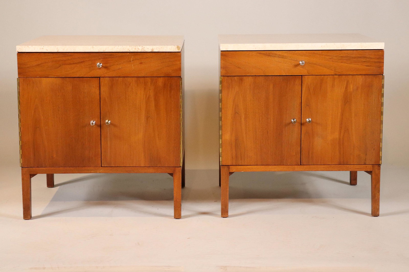 Pair of Travertine Walnut Paul McCobb Cabinets: American, 20th C. each labeled in drawer "Calvin/Grand Rapids/Furniture Designs by Paul McCobb"approx. 24 1/2"h x 22"w x 20"d