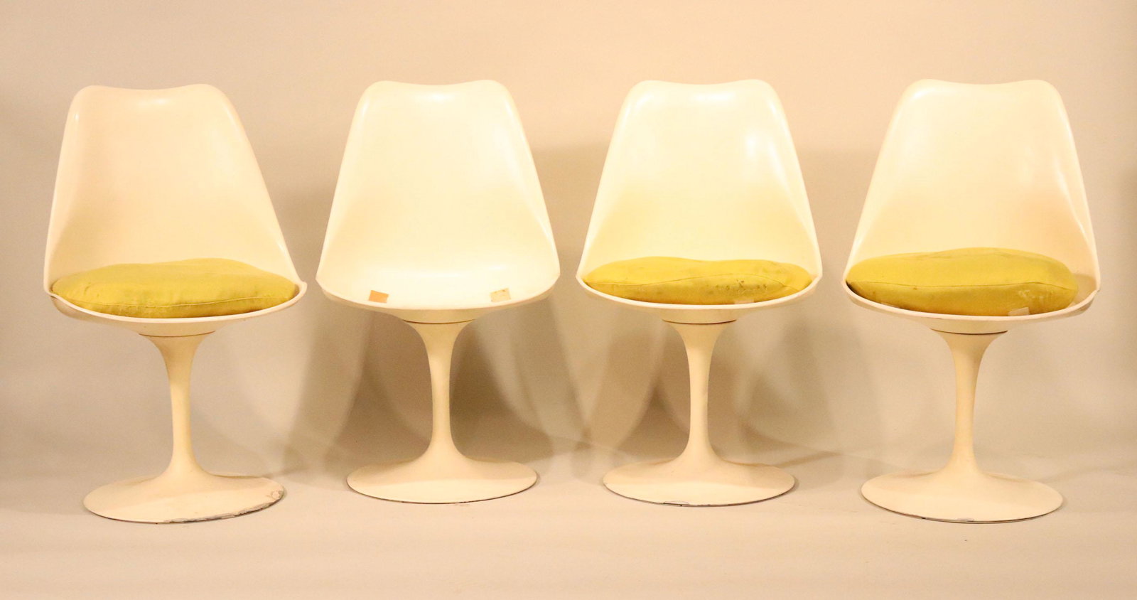 Four Eero Saarinen For Knoll Tulip Chairs: C. 1970, labeled under seat. One cushion missing, other cushions stains, chips and losses to edges. 31-1/2"h x 19"w