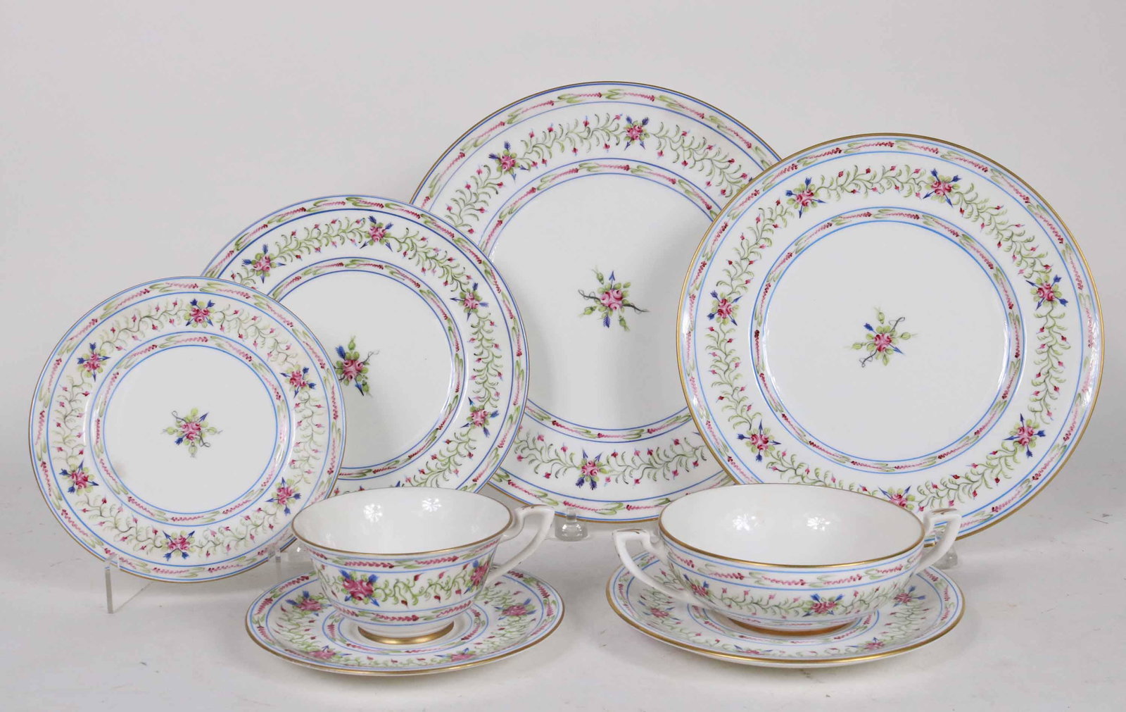 Tiffany&Co. Private Stock Hand-Painted Dinnerware: Made in France, signed underside, floral decorated. Comprising, eight dinner plates, eight luncheon plates, eight salad plates, nine bread and butter plates, eight teacups and eight saucers, and eight