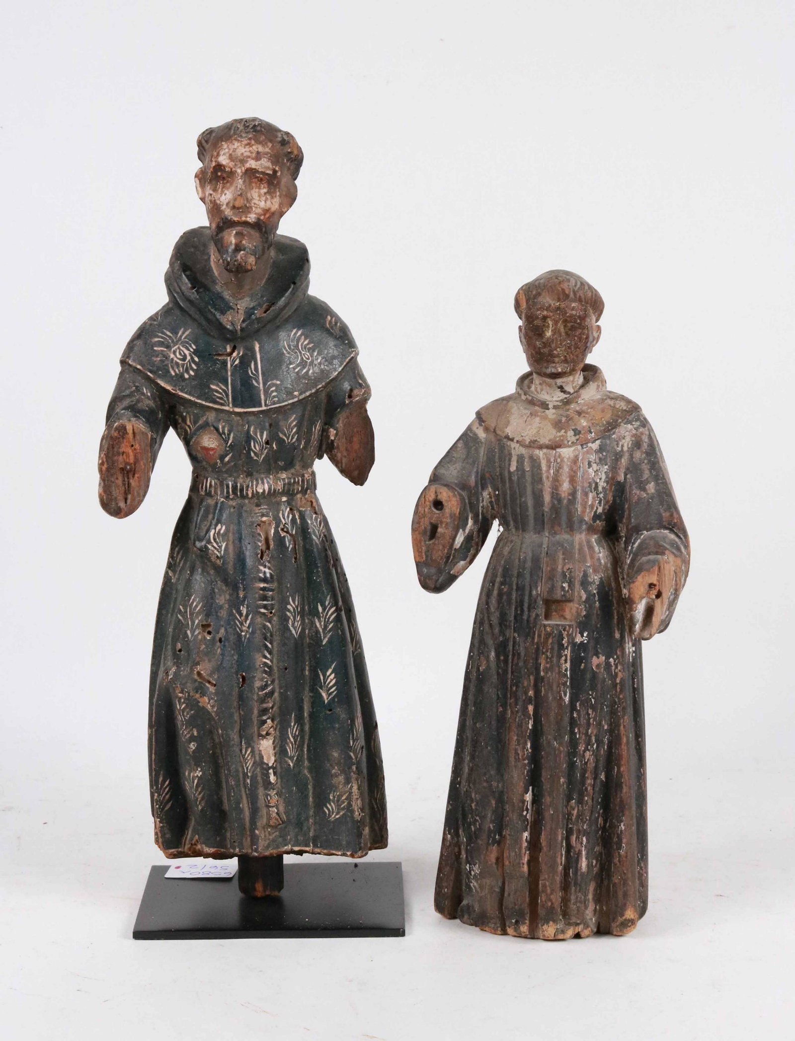 Two Carved and Painted Santos Figures: 19th C. figures of monks or abbots. Losses to paint, wood and hands. 13-1/2"h