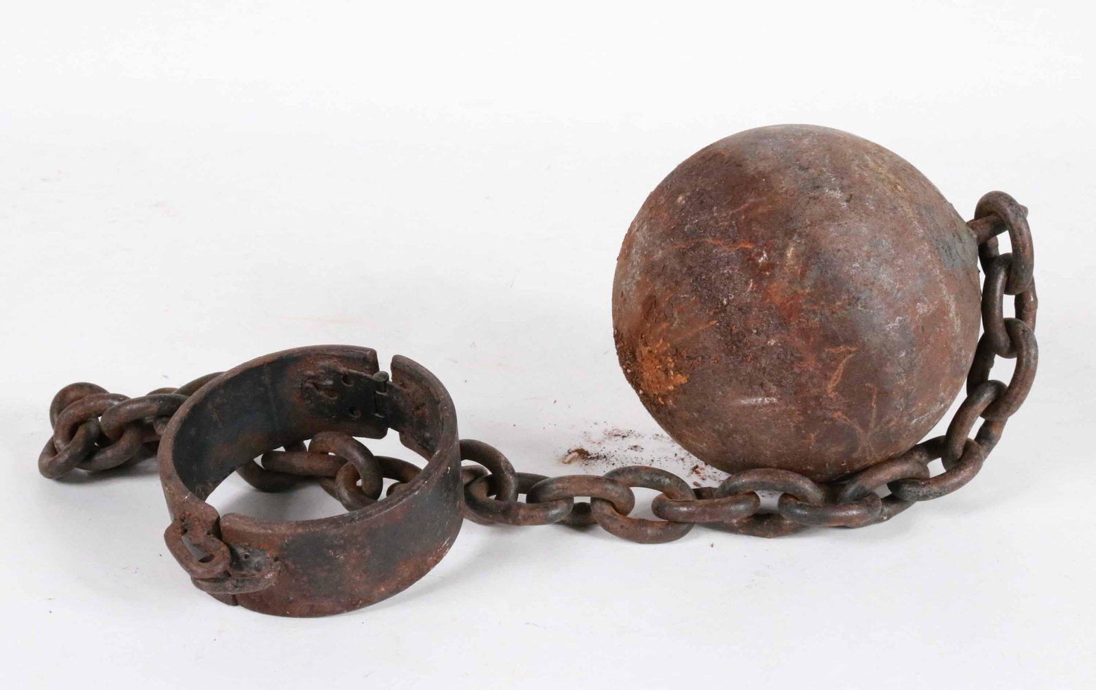 Cast Iron Ball and Chain: 19th/20th C. Ball: 6"dia. Overall: Apx. 34"l Provenance: Property from the Siegmund Collection of Folk Art, New York, New York Additional works from Siegmund Collection will be available at Christie's