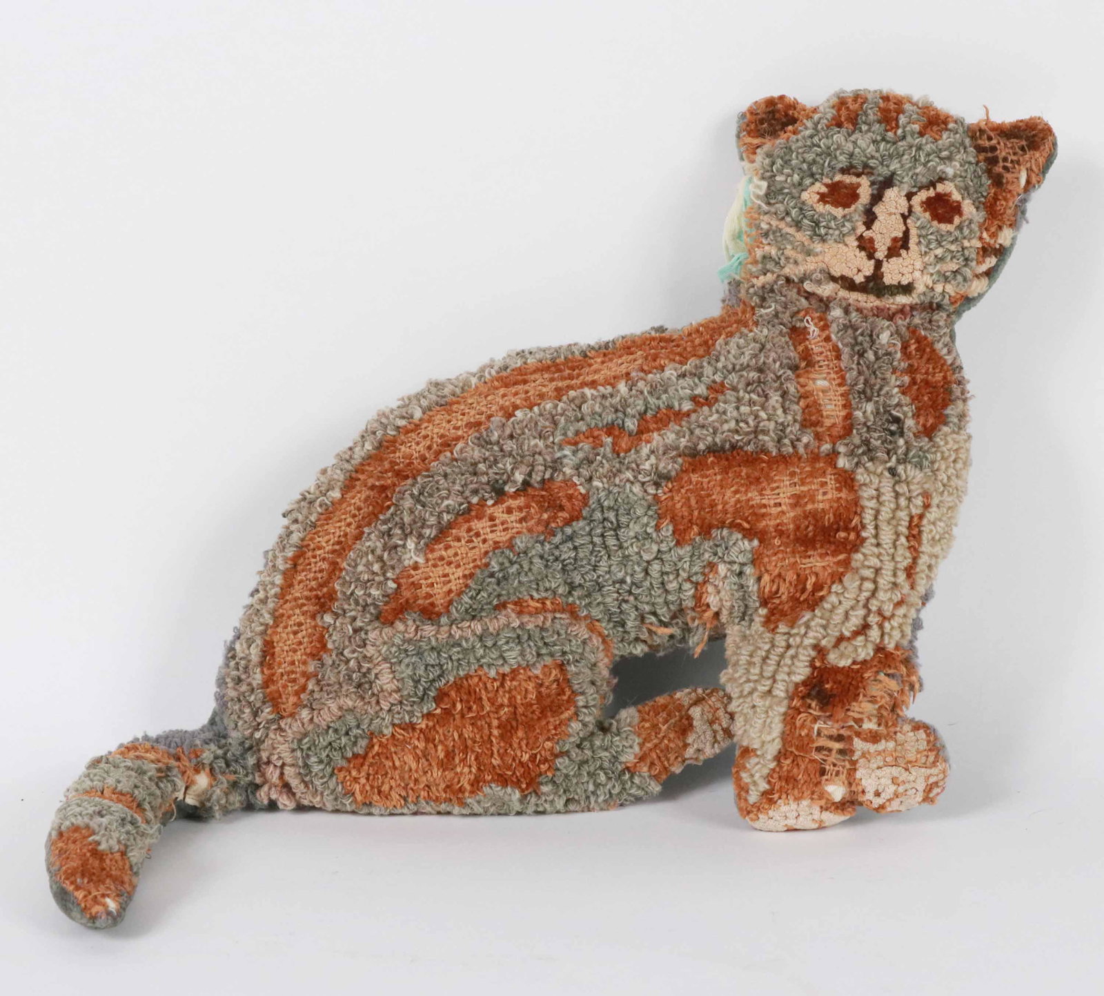 Hooked Wool Cat Pillow: American, 19th/20th C. Losses Apx. 10"h x 14"w Provenance: Property from the Siegmund Collection of Folk Art, New York, New York Additional works from Siegmund Collection will be available at Christie