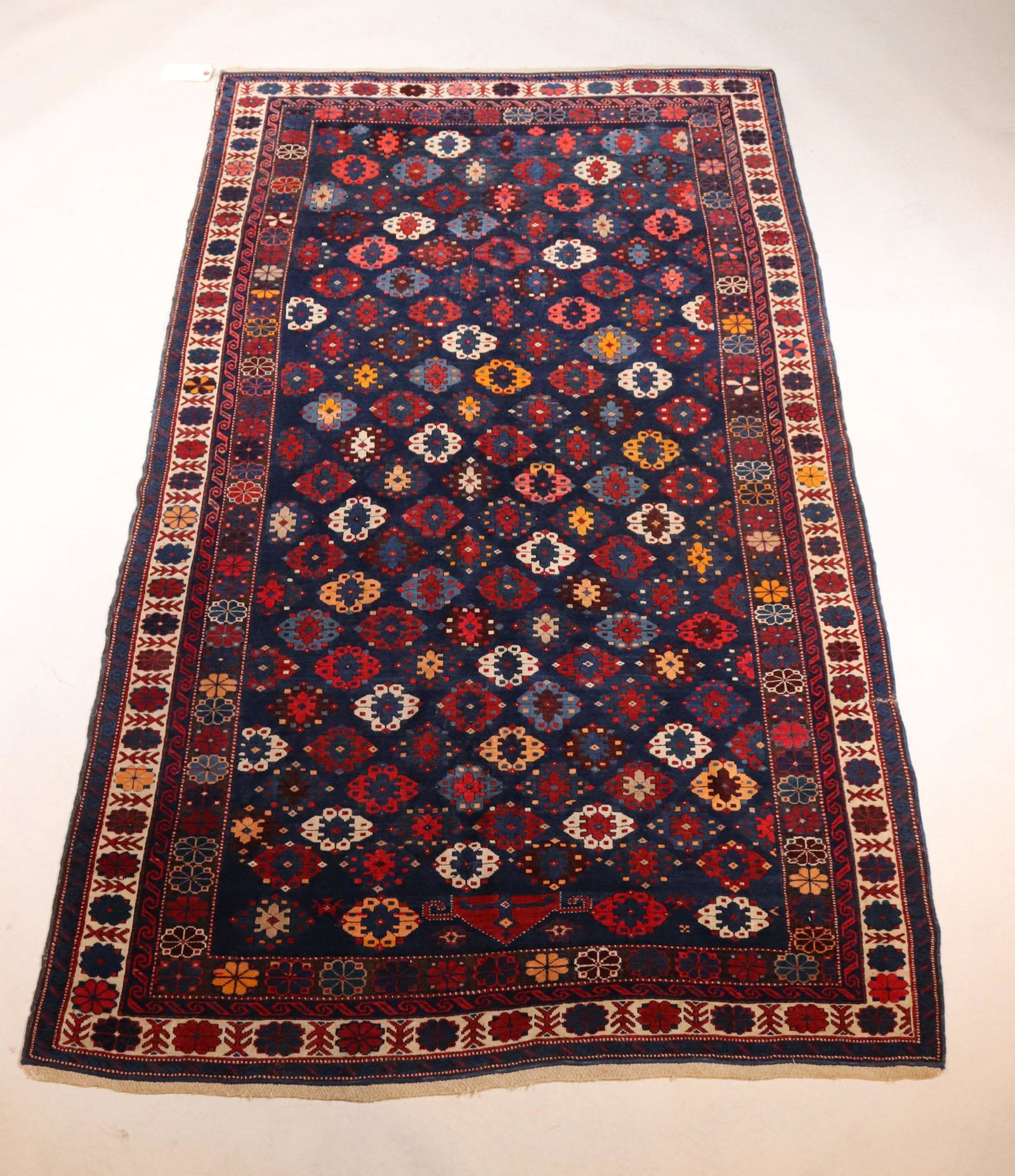 Kuba Rug: Northeast Caucasus, c. 1900. Apx. 92"l x 51-1/2"w Provenance: Property from the Estate of Robert K. Johnson of Maine and South Carolina