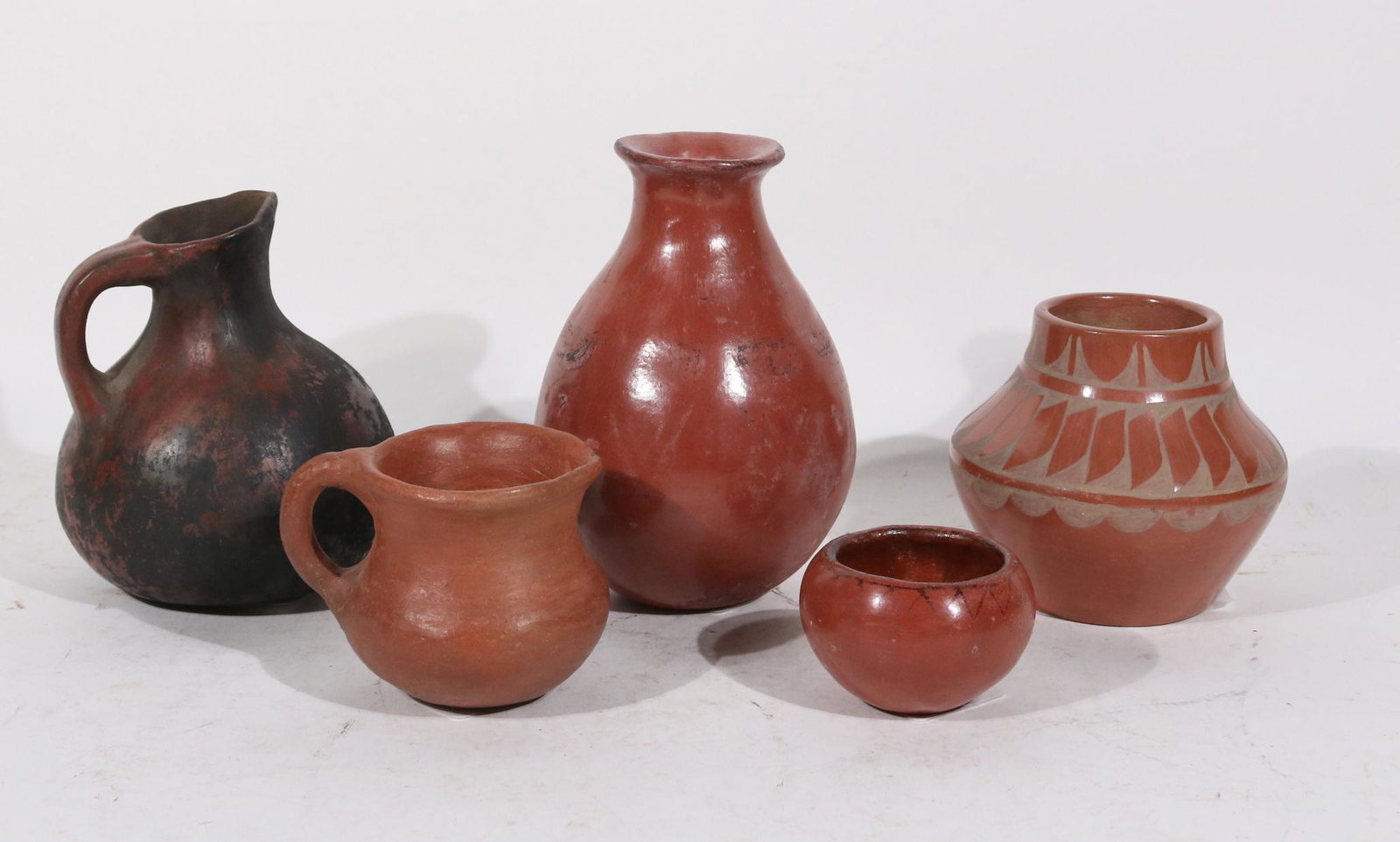 Five Southwestern Redware Pottery Vessels: One signed "Alfred Aquilar, San Ildefonso, Pueblo, New Mexico." From: 2"h to 6-3/4"h
