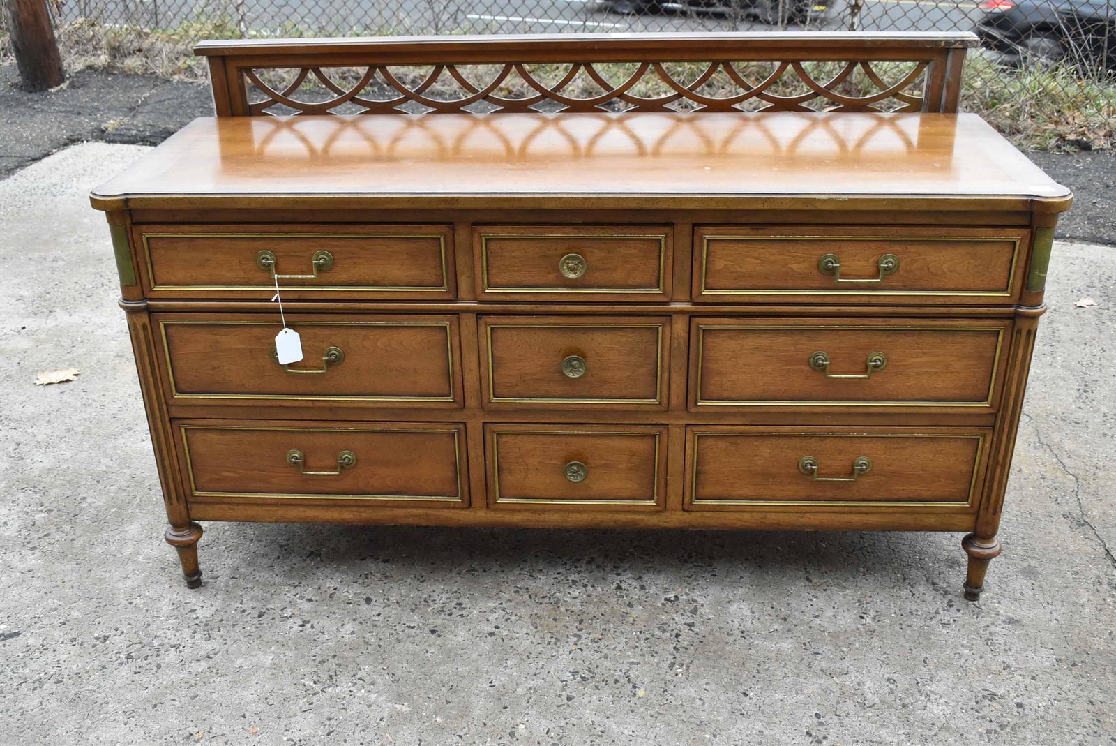 Louis XVI Style Dresser: Louis XVI Style Dresser. Stamped Bodart and labeled Bodart Furniture Inc., Grand Rapids, Michigan, 20th C. Together with a headboard. Used condition, wear, worn, surface distress. 33-1/2"h x 66"w x 22