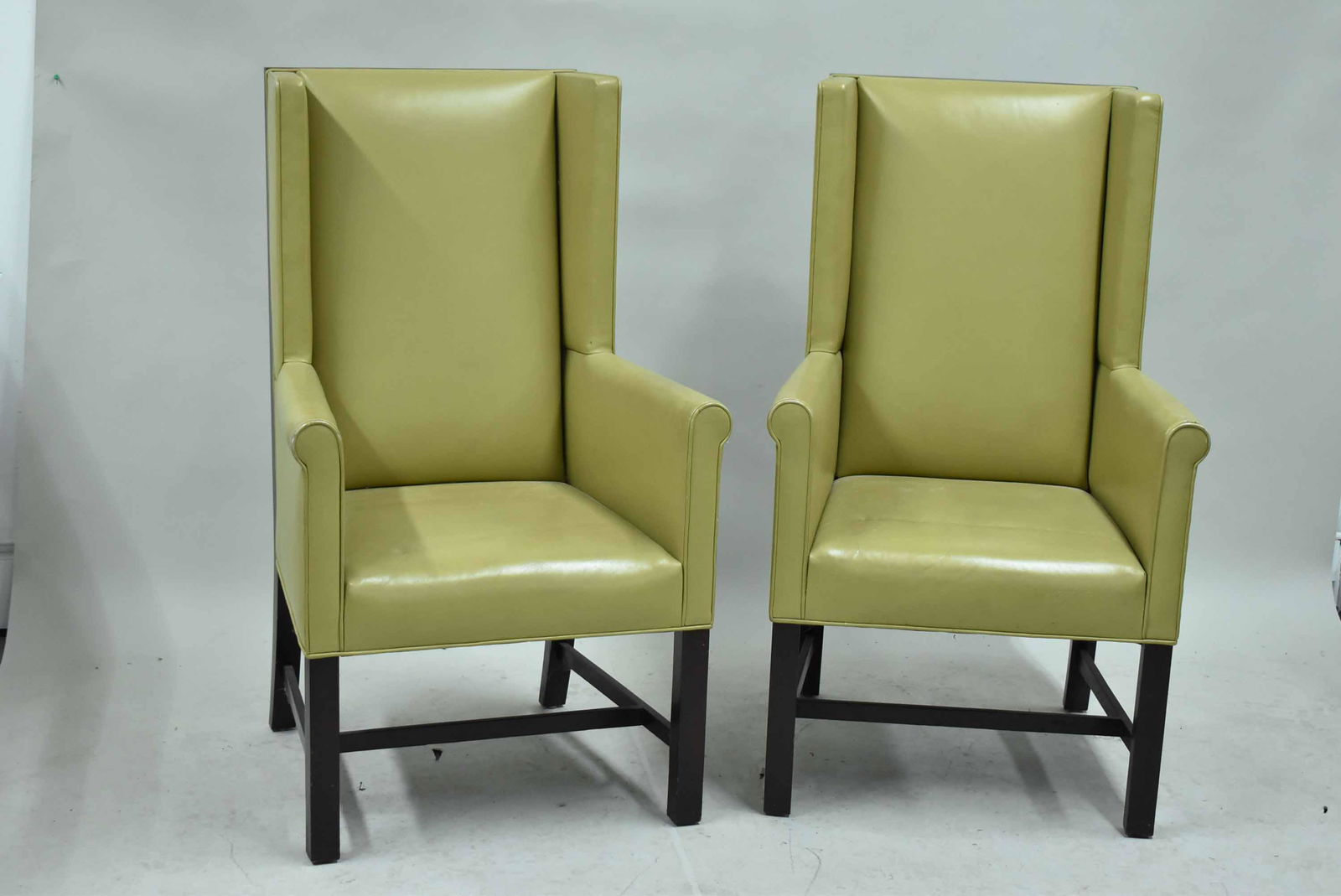 Pair of Modern High Back Wing Chairs: Pair of John Hutton Style Modern High Back Leather Wing Chairs unmarked. Used condition, wear, worn, marks and holes to leather. 46" x 27" x 26"
