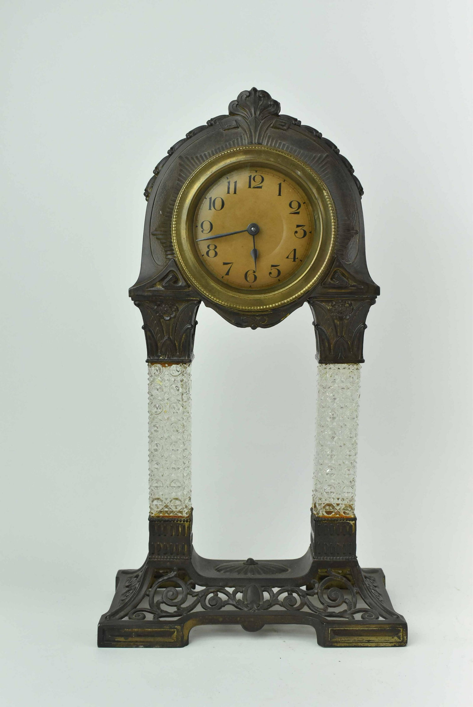 Art Nouveau Gilt Metal Mantle Clock: Art Nouveau Gilt Metal Mantle Clock with pressed glass columns and wind up movement; used condition, wear/worn, gilt loss, missing key, unknown working condition, measures 16" high x 9" long x 4 1/2" 