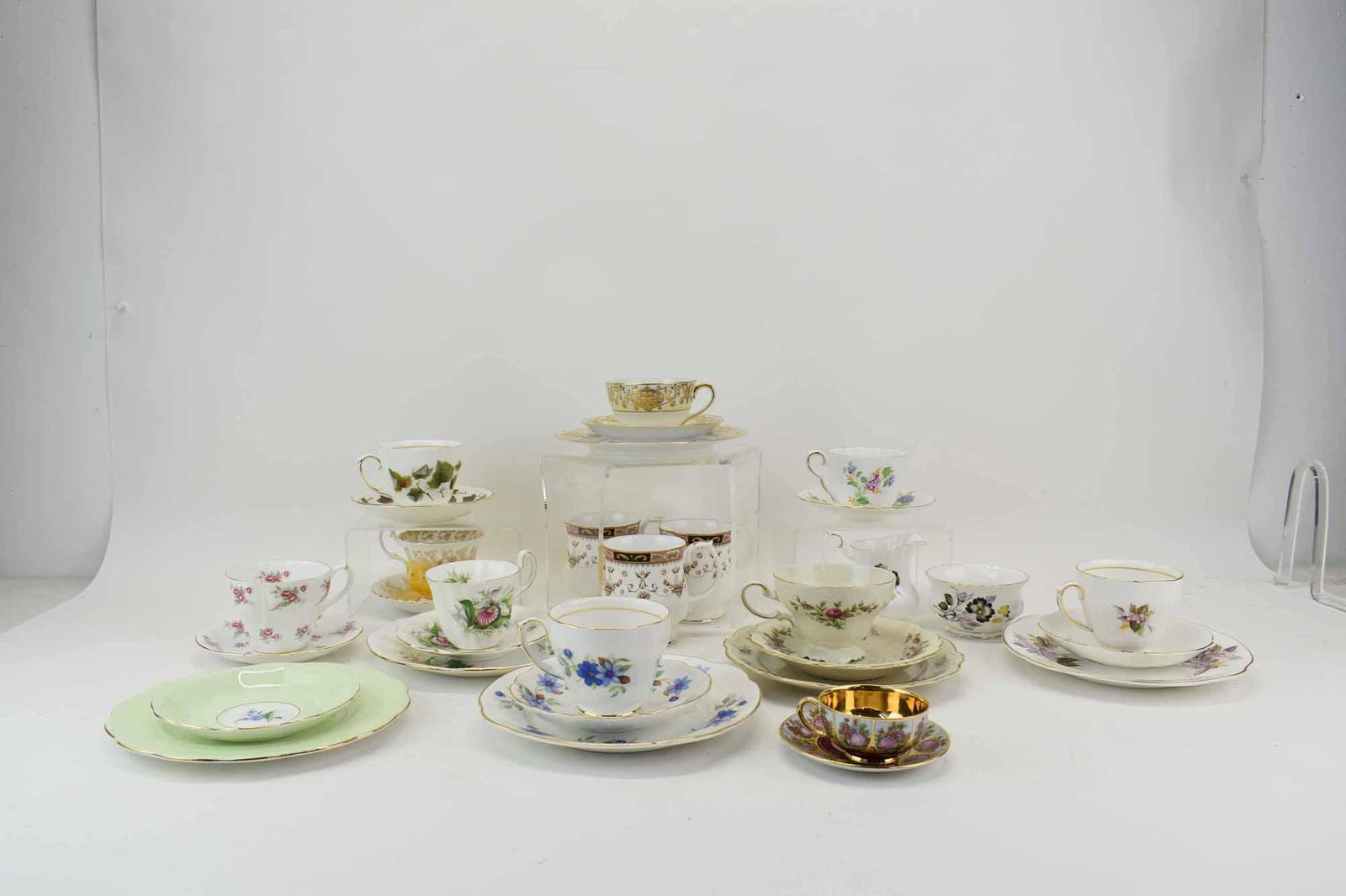 Group of Assorted Trio Cup & Saucer Sets: Group of Assorted Trio Cup & Saucer Sets comprising of Royal Adderley Canadian Provincial Flowers, Rosenthal Pompadour, Duchess Sapphire, Duchess Winnoth, and Noritake. Together with cup and saucer se