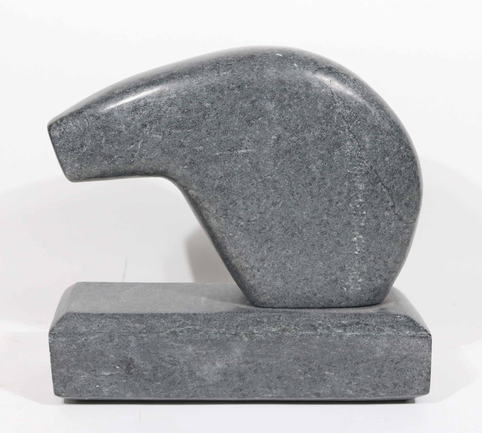 Zuni Carved Stone Fetish, J. Quintang: Signed J. Quintang, New Mexican, dated '90, possibly depicting a bear. 9-1/2"h x 3-3/4"w x 10"l