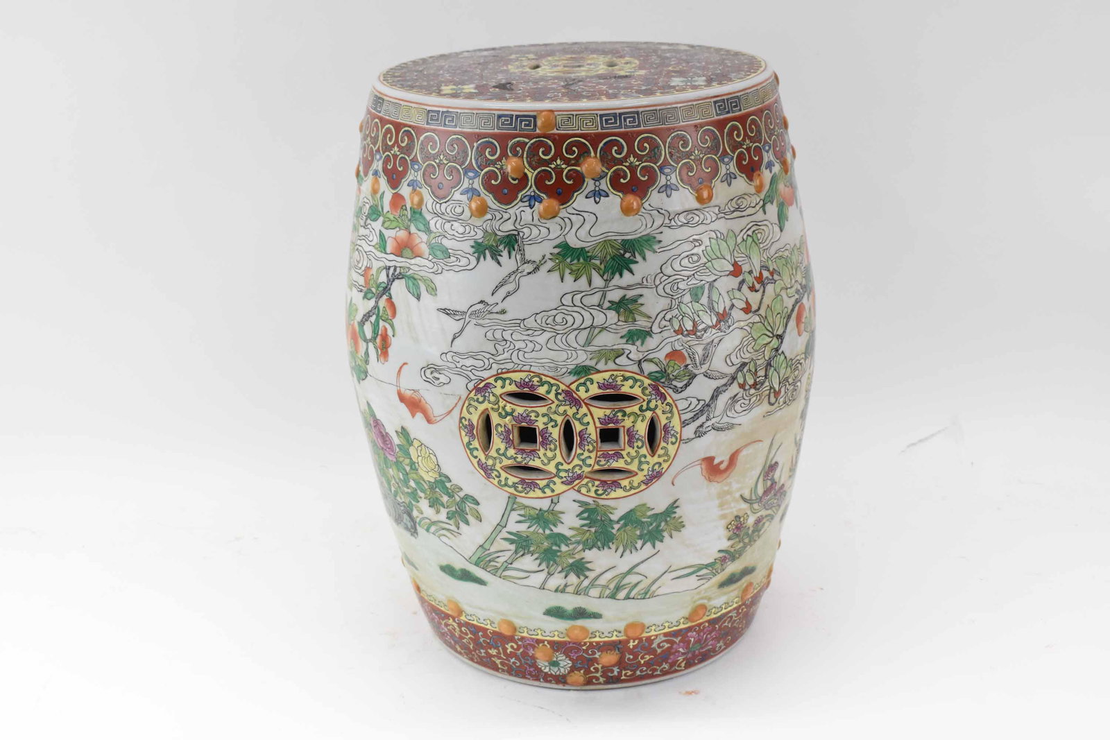Chinese Porcelain Polychrome Garden Seat: Chinese Porcelain Polychrome Garden Seat Stool having Chinese Famille Rose pattern; used condition, wear/worn, measures 19" high x approx 12 3/4" diameter