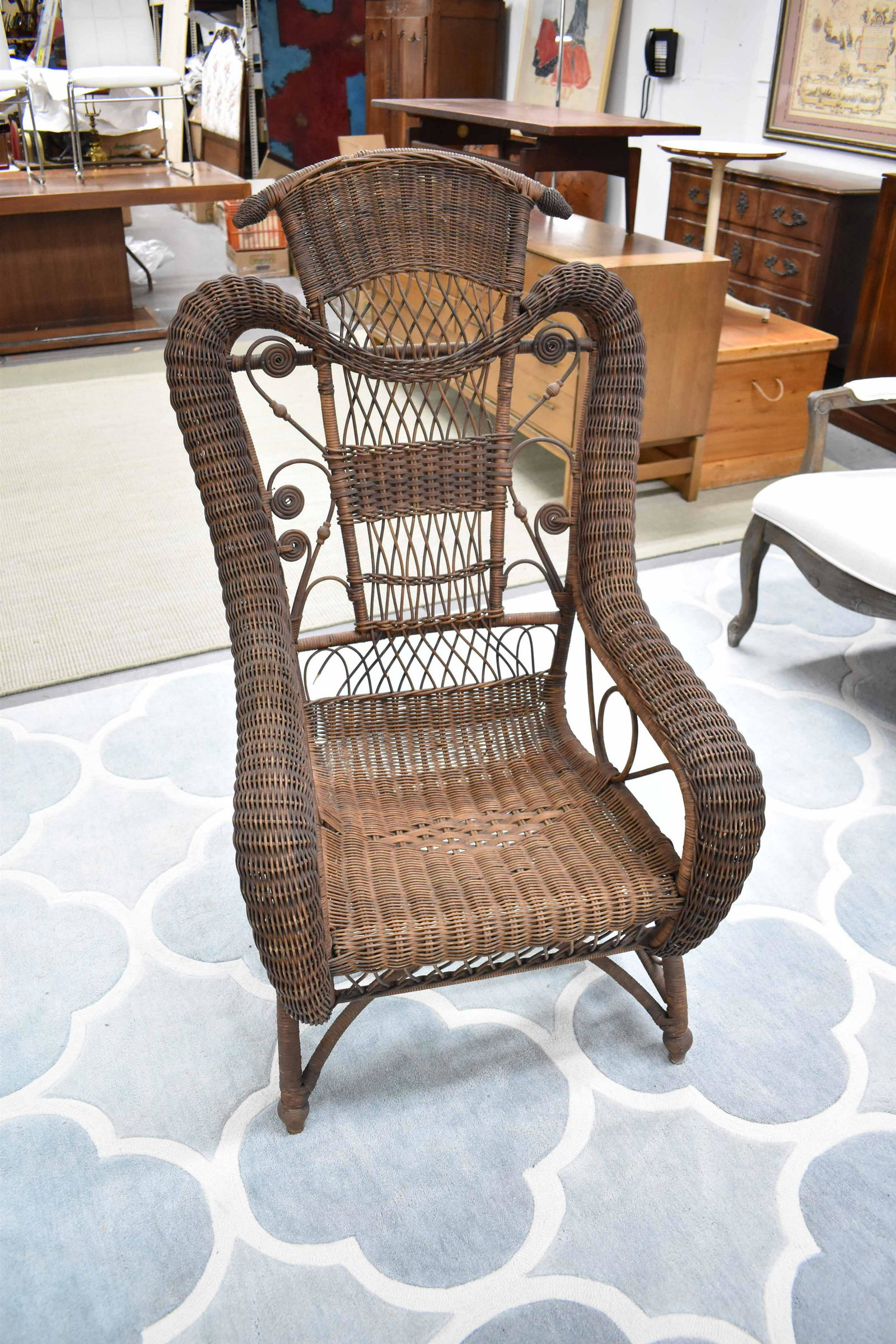 Natural Wicker Platform Rocking Arm Chair: Natural Wicker Platform Rocking Arm Chair, marked on spring hangers 'WERYAN PAT JUNE 11 '95'; used condition, wear/worn, measures 48" tall x 25" deep x 27 1/2" wide (15 1/2" tall to top of seat)