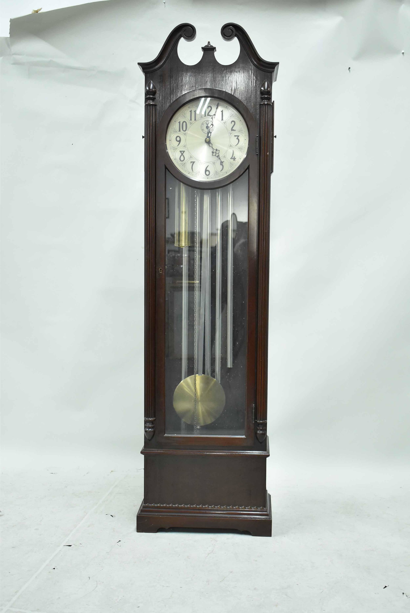 Herschede Cincinnati Mahogany Grandfathers Clock: Herschede Cincinnati Mahogany Grandfathers Clock marked on brass works. Used condition, wear/worn, works over wound, unknown working condition, repair to finial. 72" tall x 19 3/4" wide x 11" deep