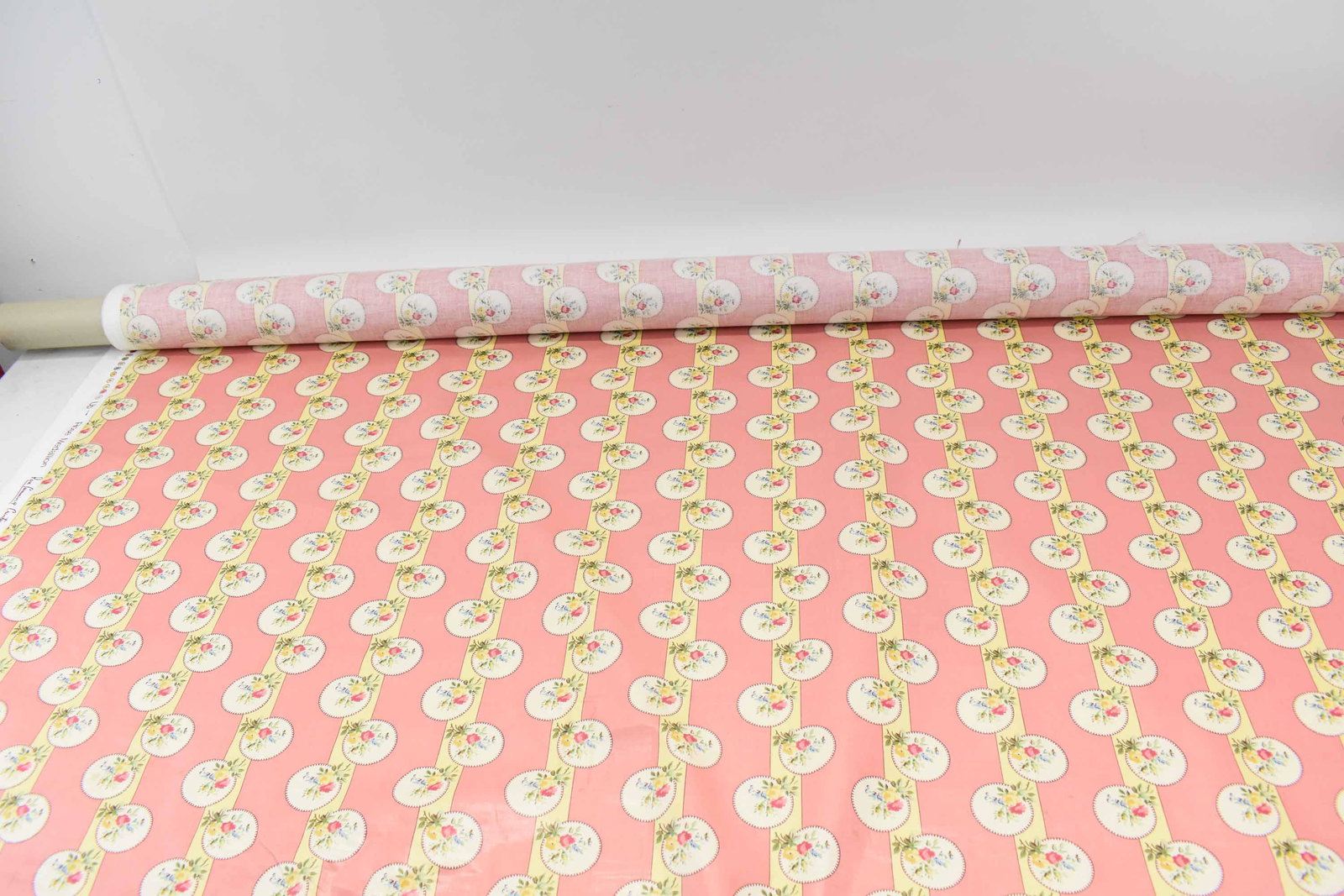 Rose Cumming Rose Medallion Fabric: Rose Cumming Rose Medallion Chintzes Ltd. Fabric, striped pink and yellow with floral medallions; measures 7 yards long x 52 1/4" wide, soiling on the edges