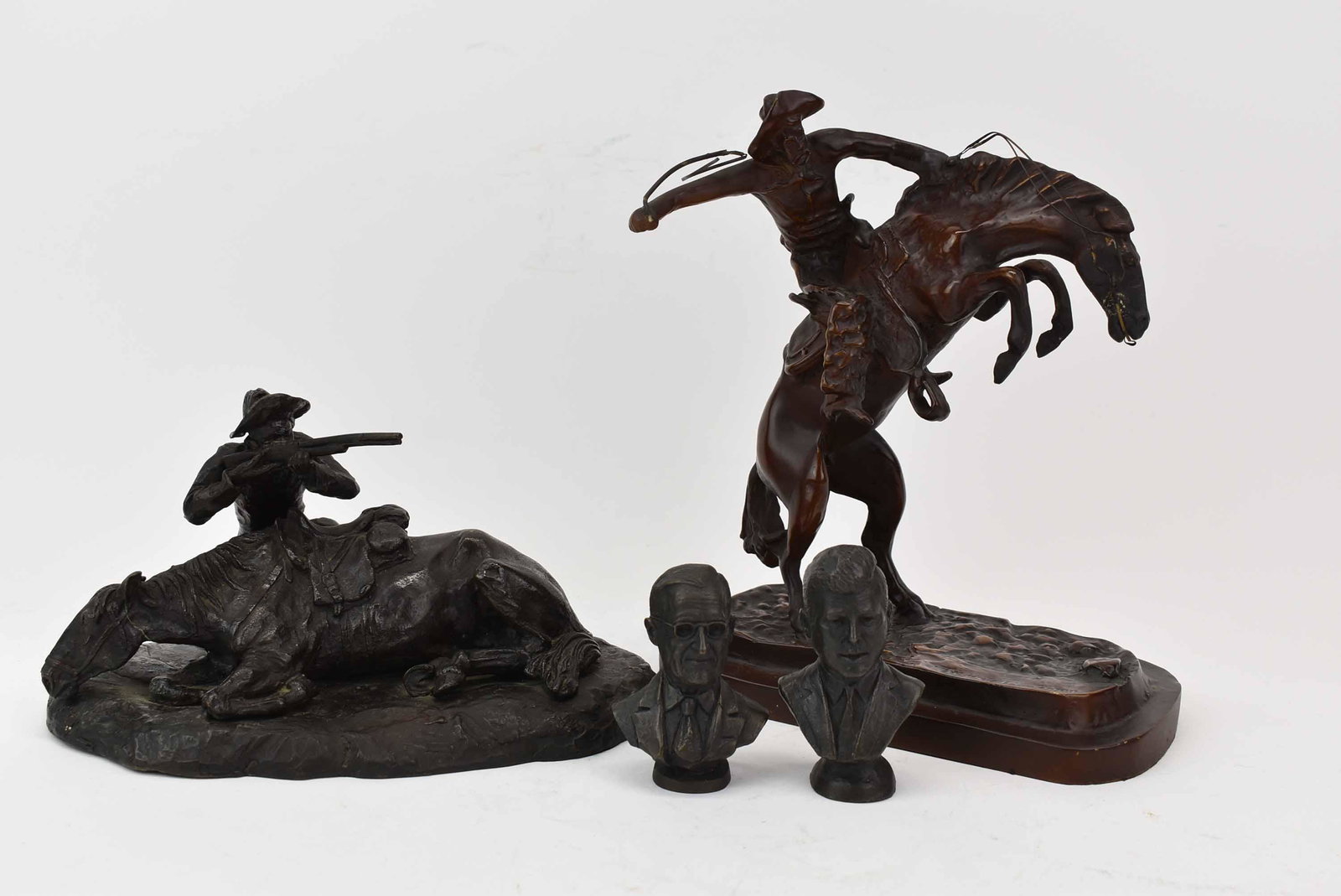 After Remington Small Scale Bronze Bronco Buster: After Remington Small Scale Bronze 'Bronco Buster', Impressed Frederic Remington. Together with a Cast Bronze Man Shooting over Horse, unsigned, depicting cowboy shooting rifle over his horse used for