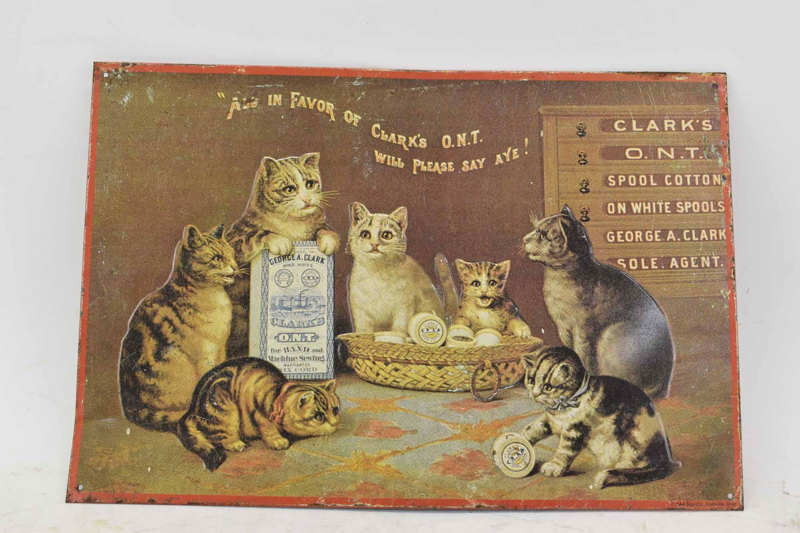 Clark's Cotton O.N.T. Metal Advertising Sign: Clark's Cotton O.N.T. Metal Advertising Sign with kittens, "ALL IN FAVOR OF CLARK'S O.N.T. WILL PLEASE SAY AYE!", marked AAA Sign Co. Coitsville Ohio; used condition, wear/worn, paint loss, surface di