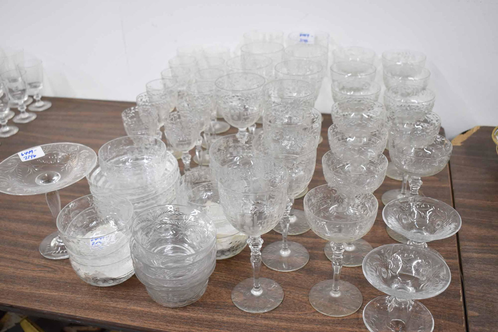 Group of Assorted Elegant Cut Crystal Stemware: Group of Assorted Elegant Cut Crystal Stemware including 11 water goblets, 12 wine glasses and 12 champagne, together with matching dessert bowls and plates and similar cut crystal compotes and bowls;