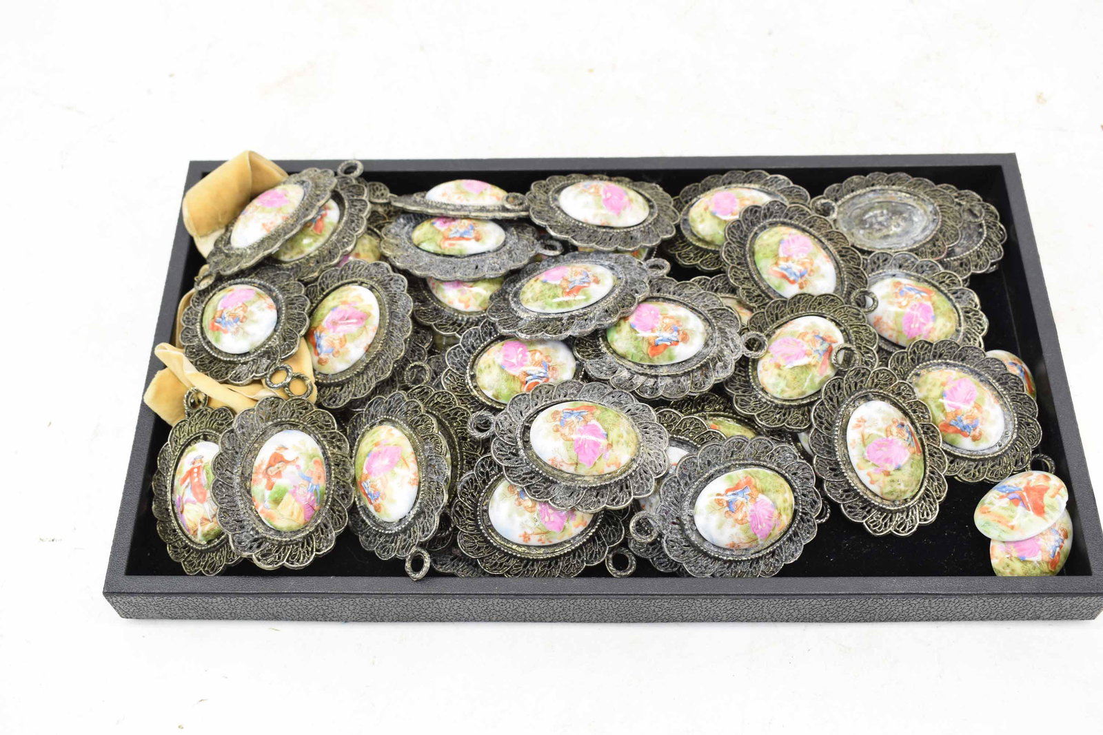 Large Group of Porcelain Courting Scene Cameos: Large Group of Porcelain Romantic Courting Scene Cameos mounted on metal plaques, 50 in total (4 need to be reattached), porcelain stamped Made in Japan; used condition, wear/worn, chips, surface dist
