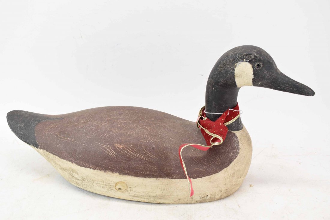 Carved Wooden Canadian Goose Decoy.: Carved Wooden Canadian Goose Decoy. 20th C Used condition, wear, split to base and crack to neck. 10"h x 20-1/2"w x 7-1/2"d