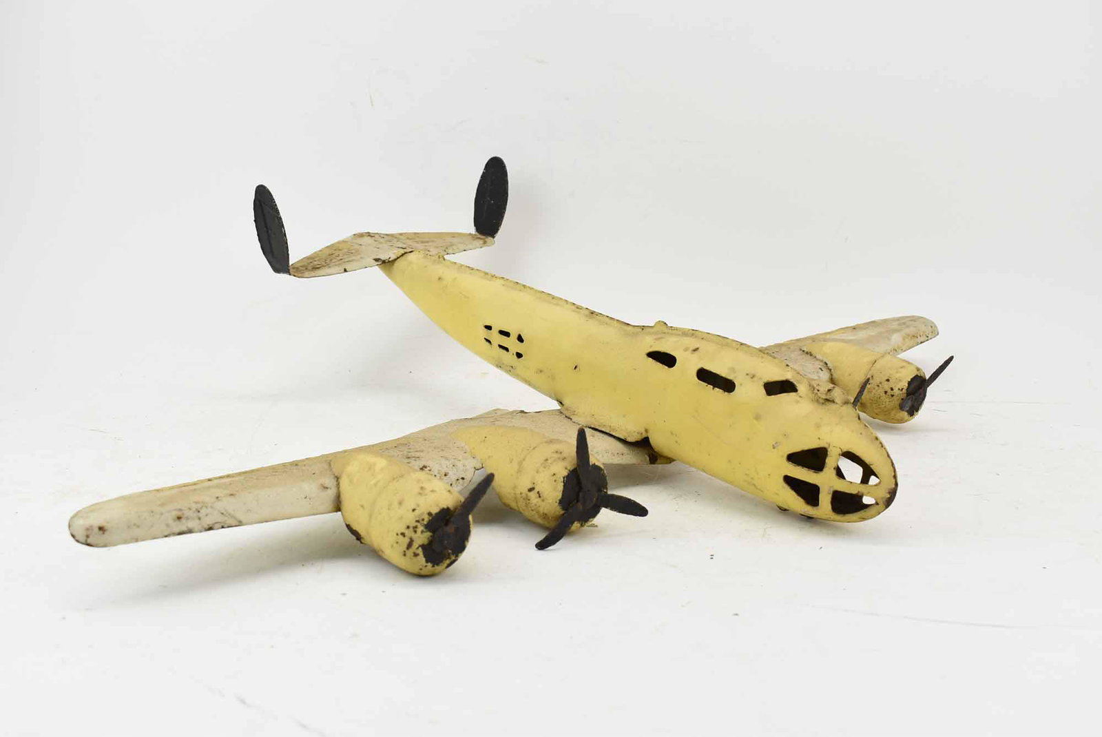 Buddy L Pressed Steel Toy Airplane: Buddy L Pressed Steel Toy Airplane, 1930s; used condition, wear/worn, rusting, missing front wheel and parts to propeller, measures 27" long x 19 1/2" long x 6" high