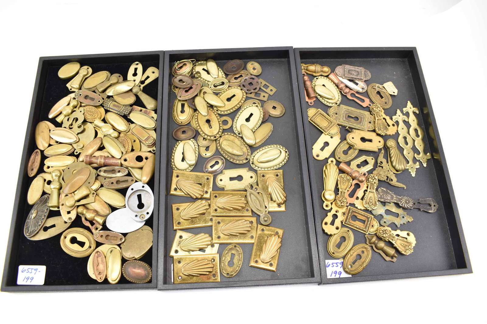 Large Group of Brass Keyhole Covers Escutcheons: Large Group of Brass Keyhole Covers Escutcheons of various shapes and sizes; used condition, wear/worn