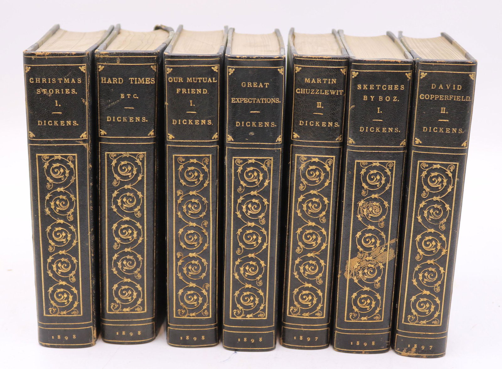 36 Volumes of The Works of Charles Dickens: Published in 1898 by Chapman & Hall, Ltd. London and Charles Schibner's Sons, New York. Water damage, losses. All books sold "as is." No guarantees made about number of books in lot or condition of bo
