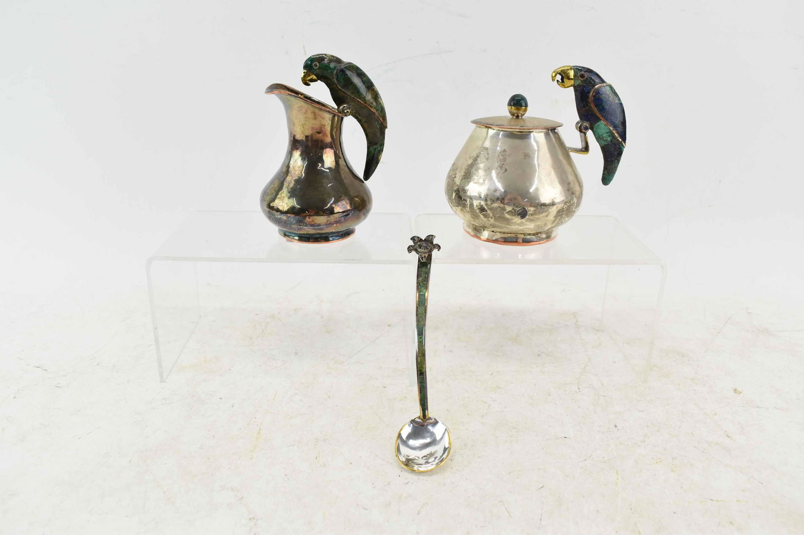 Emilia Castillo Parrot Cream & Sugar Set: Emilia Castillo Parrot Cream & Sugar with Malachite Parrot Handles and Inlaid Spoon, stamped on verso; used condition, wear/worn, tarnished, creamer is missing gemstone eyes, sugar bowl measures 4 3/4