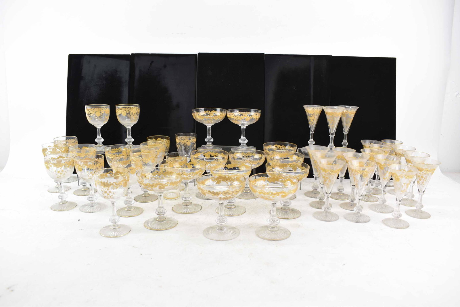 (73pcs) St Louis Massenet Clear Crystal Stemware: 73 Pieces of St Louis Massenet Clear Crystal Stemware having gold encrusted pattern comprising of 12 champagne/tall sherbet (4 1/4"), 13 burgundy wine (4 3/4"), 18 sherry (4 3/4"), 11 finger bowls (4 