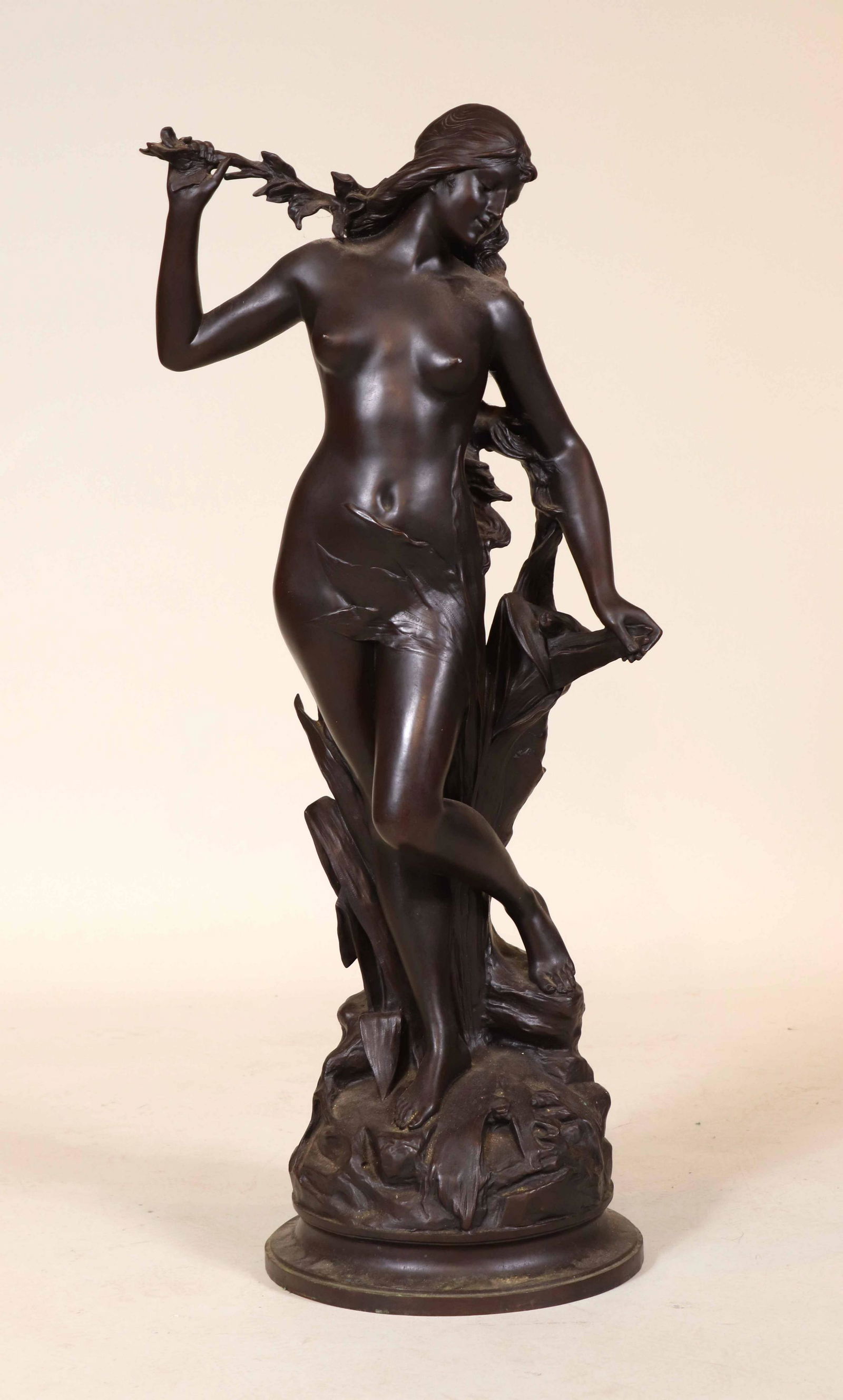 Edouard Drouot, Bronze, Female Nude with Leaves: (French, 1859-1945) titled "Nu Feminin dans un Entourage Feuillage." 34"h