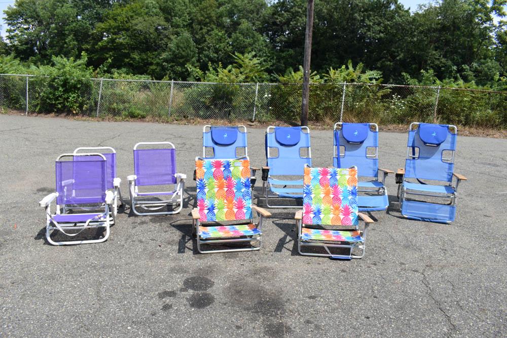 Set of Four Folding Pool Lounge Chairs: Set of four folding pool lounge chairs together with five beach chairs. Used condition, wear, worn.