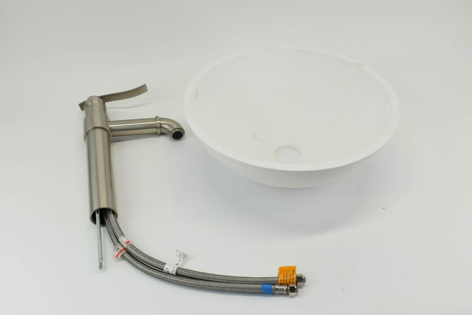 Graff Single-Hole Bali Vessel Faucet: Graff Single-Hole Bali Vessel Faucet together with a round white composition vessel sink/basin Faucet: Unused unknown working condition Basin/Vessel: Rough edges, fleabites Graff Faucet Model Number G