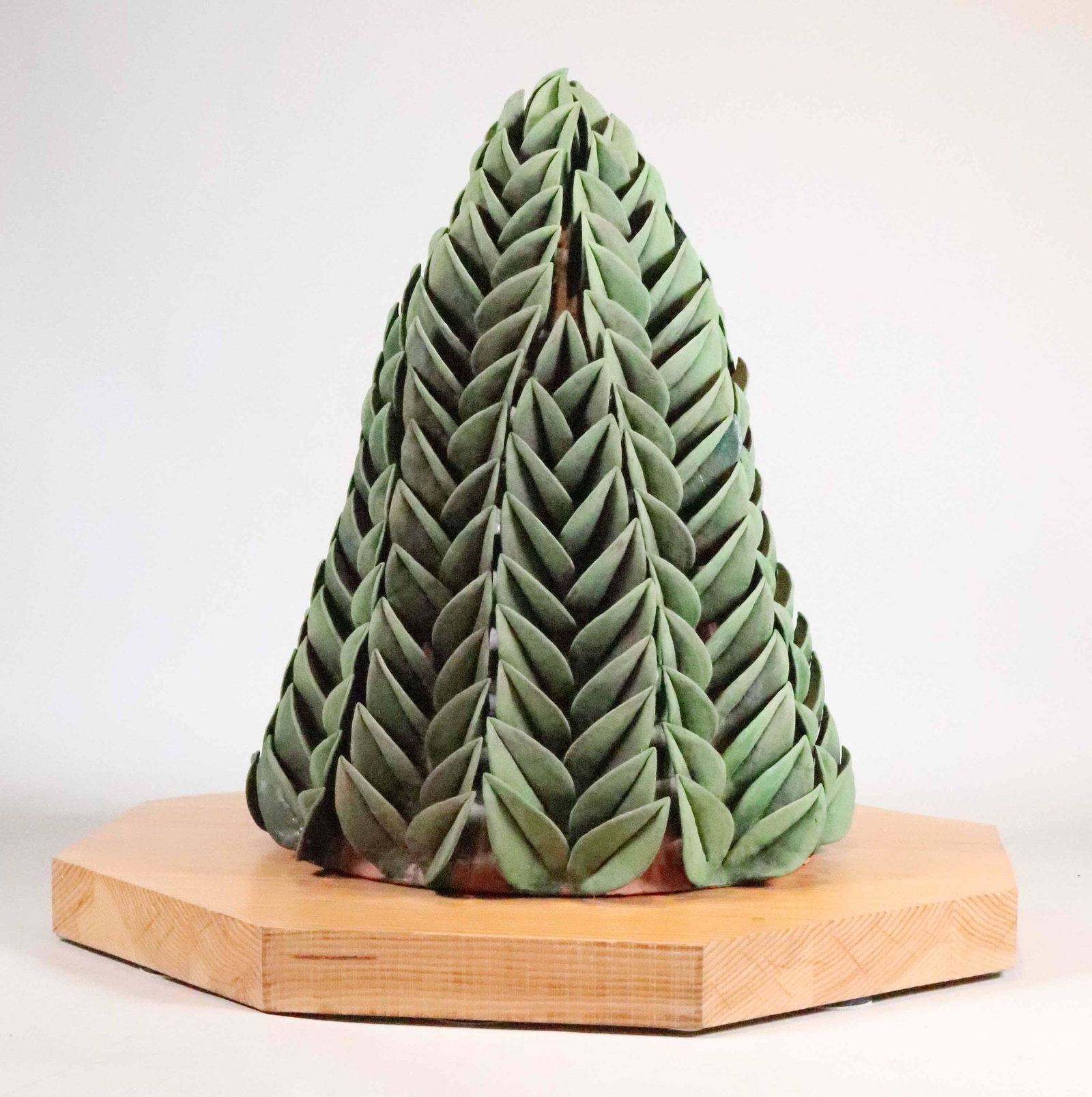 Kim Dickey Green Glazed Earthenware Pine Tree: On octagonal wood base. Tree: 34"h Apx. Base: 3-1/4"h x 40"dia. Property from a Short Hills, NJ and San Francisco, CA Private Collection