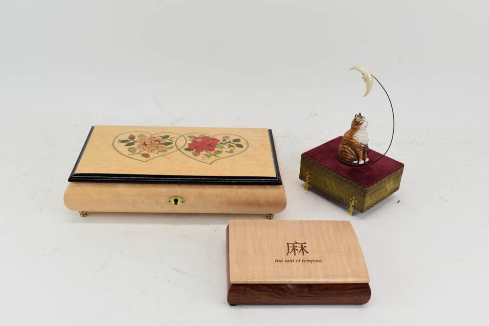 Reuge Romance Swiss Made Music Box: Reuge Romance Swiss Made Music Box having the melody Wind Beneath My Wings and decorated with inlaid heart and floral design. Together with Reuge cat and moon music box made in France with the melody 