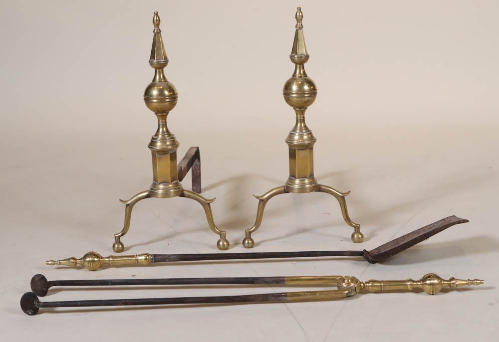 Pair of Federal Cast-Brass Steeple-Top Andirons: New York, 19th C. Together with a similar set of Federal steeple-top tongs and shovel, 3 pieces Andirons: 18"h x 9"w x 18"d Shovel: 30"l Provenance: Property from a Private Collection