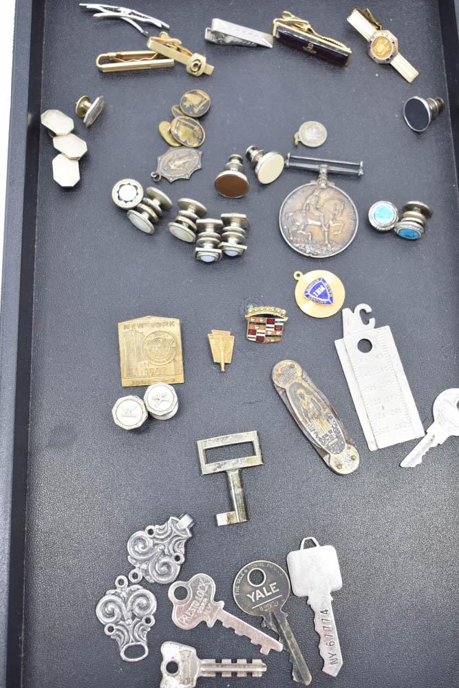 Group of Men's Jewelry Items: Group of Men's Jewelry Items, including tie bars, one Masonic, State of New Jersey, cuff button, some mother-of-pearl, and occupational related, IBM & Cadillac. Together with a Georg IV 1914-1918 meda