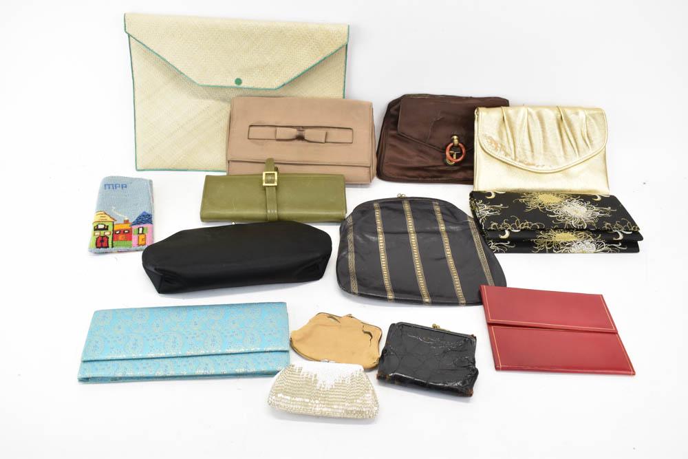 Two Vintage Mark Cross Wallets: Two Vintage Mark Cross Wallets including one tri-fold olive green leather wallet with strap closure and a black bill fold and change purse wallet with snap closure. Together with a group of assorted v