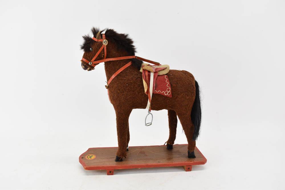 Vintage Child's Pulling Horse: Vintage Child's Pulling Horse. Used condition. Wear, worn. Missing wheel. 12"h x 13"l x 4"w.