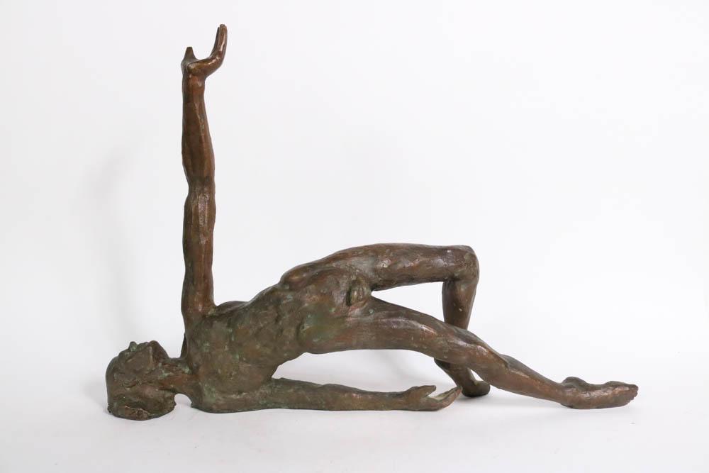 Victor Salmones Cast Bronze Reclining Male Figure: (Mexican, 1937-1989) 18-1/2"h x 25-1/2"w x 5-1/2"d Provenance: Property from the Collection of Winston and C.Z. Guest