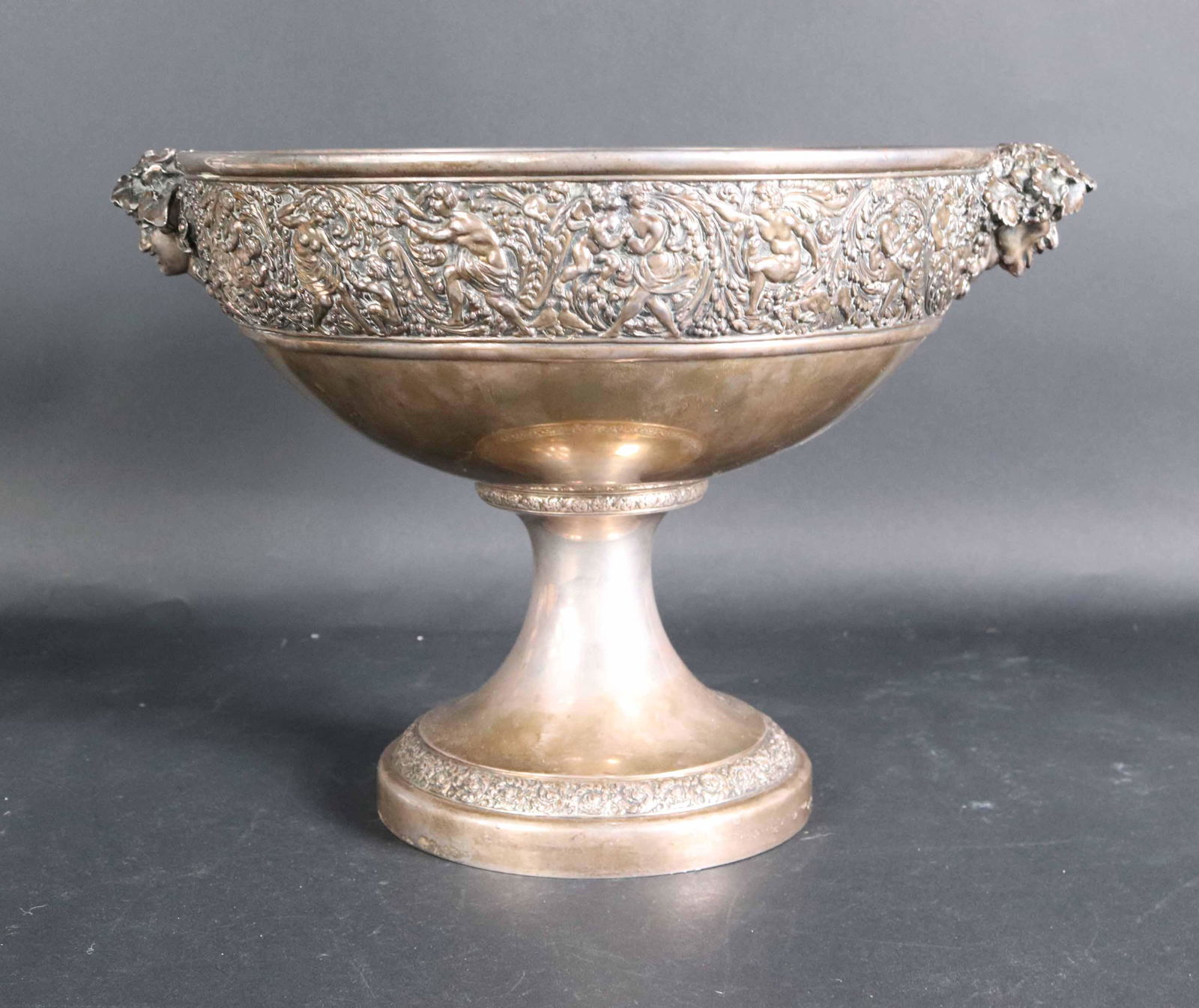 Tiffany Sterling Silver Punch Bowl with "T" Mark: Impressive 19th C. Tiffany and Co sterling silver footed punch bowl with Bacchante handles. Stamped with the "T" mark indicating the date of manufacture between 1891-1902. The letter marks also indica