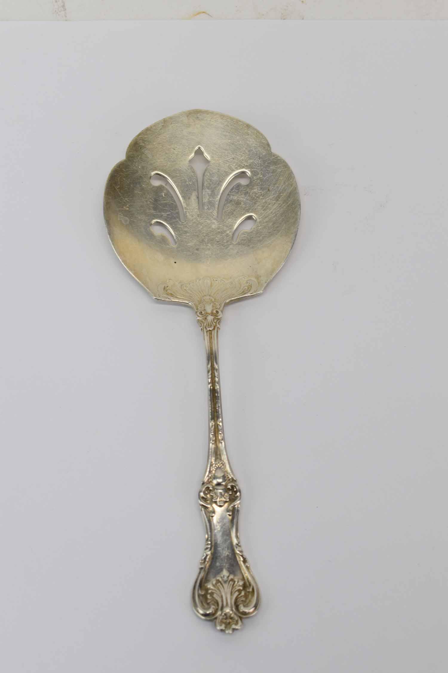 Frank Smith Sterling Silver Serving Spoon: Frank Smith Sterling Silver Tomato Slice Serving Spoon Used condition, wear, worn Appx. weight 2 T.O. Provenance: By descent, Clinedinst family, New York and Philadelphia