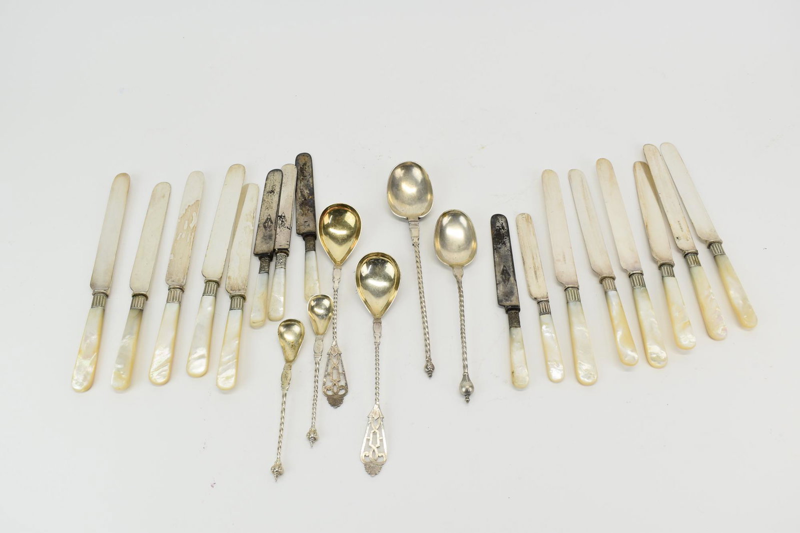 Two Assorted Mother of Pearl Dinner Knives: Two Assorted Mother of Pearl Dinner Knives including 12 Mother of Pearl handled Harrison Brothers & Howson Sheffield, stamped HB & HS, and Four Meadow City Cutlery Mother Pearl Handle Knives. Together