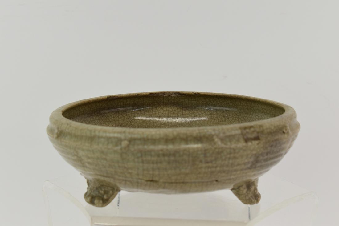 Asian Celadon Center Bowl: Asian Celadon Center Bowl having three fu lion feet Used condition, wear, worn, chips, cracks, losses Measures 7-1/2"dia x 2-3/4"h