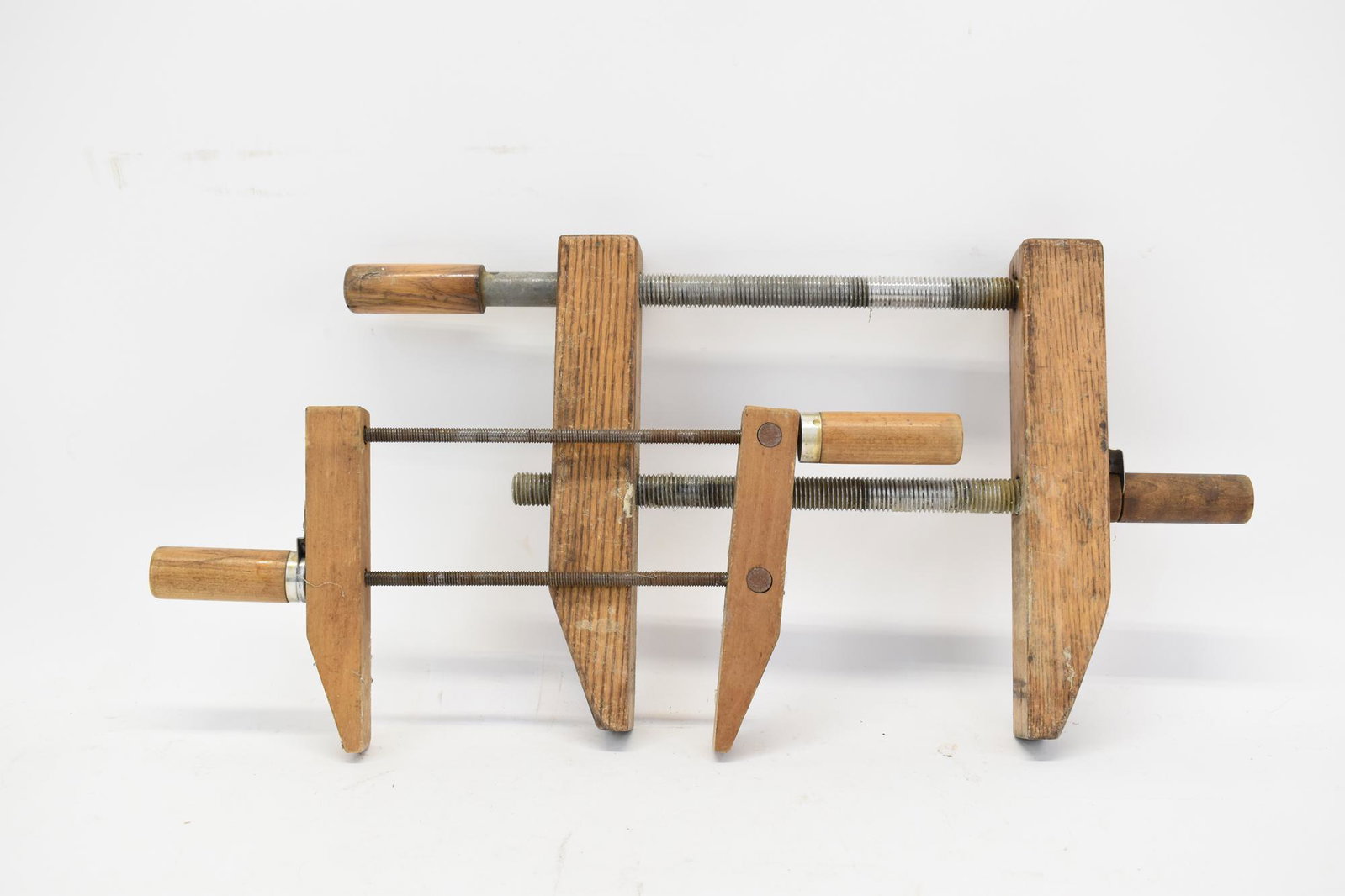 Two Vintage Wooden Carpenter's Clamps: Two Vintage Wooden Carpenter's Clamps, small clamp made of maple, large clamp made of oak Used condition, wear/worn, surface distress, nicks, scratches, surface rust The larger: 23" x 12" x 2"