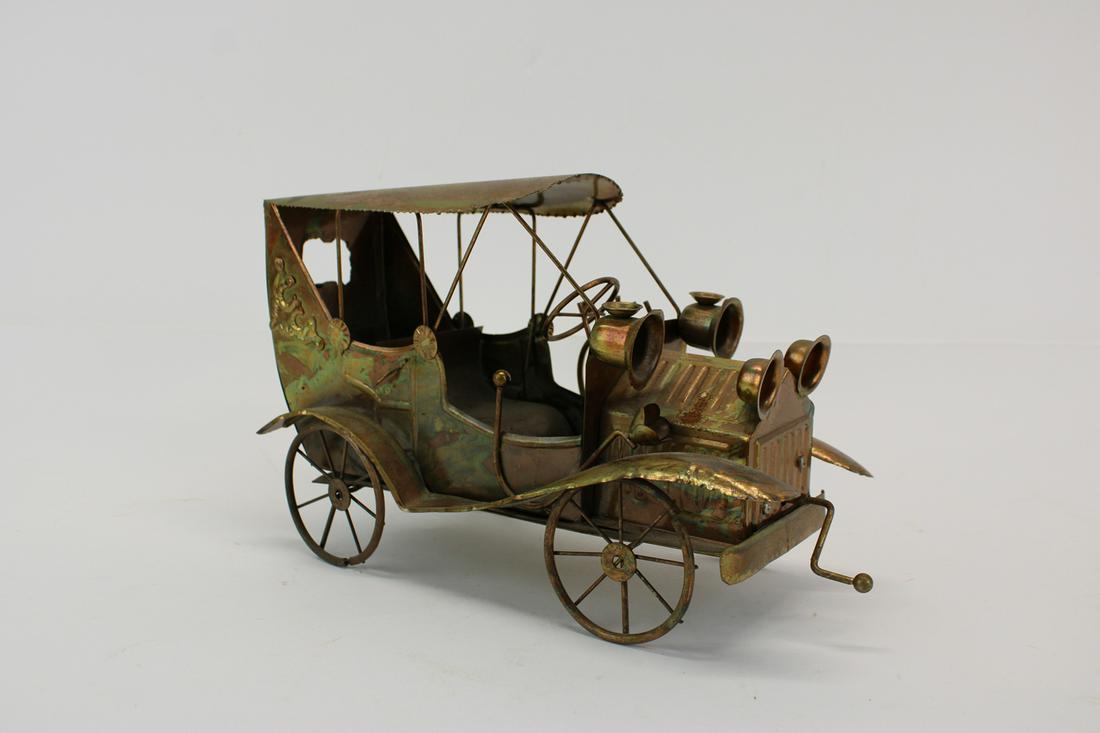 Metal Automobile Form Music Box: Metal Automobile Form Music Box, not tested for working mechanism 6-3/4"h x 12"d x 6"w Provenance: By descent, Clinedinst family, New York and Philadelphia