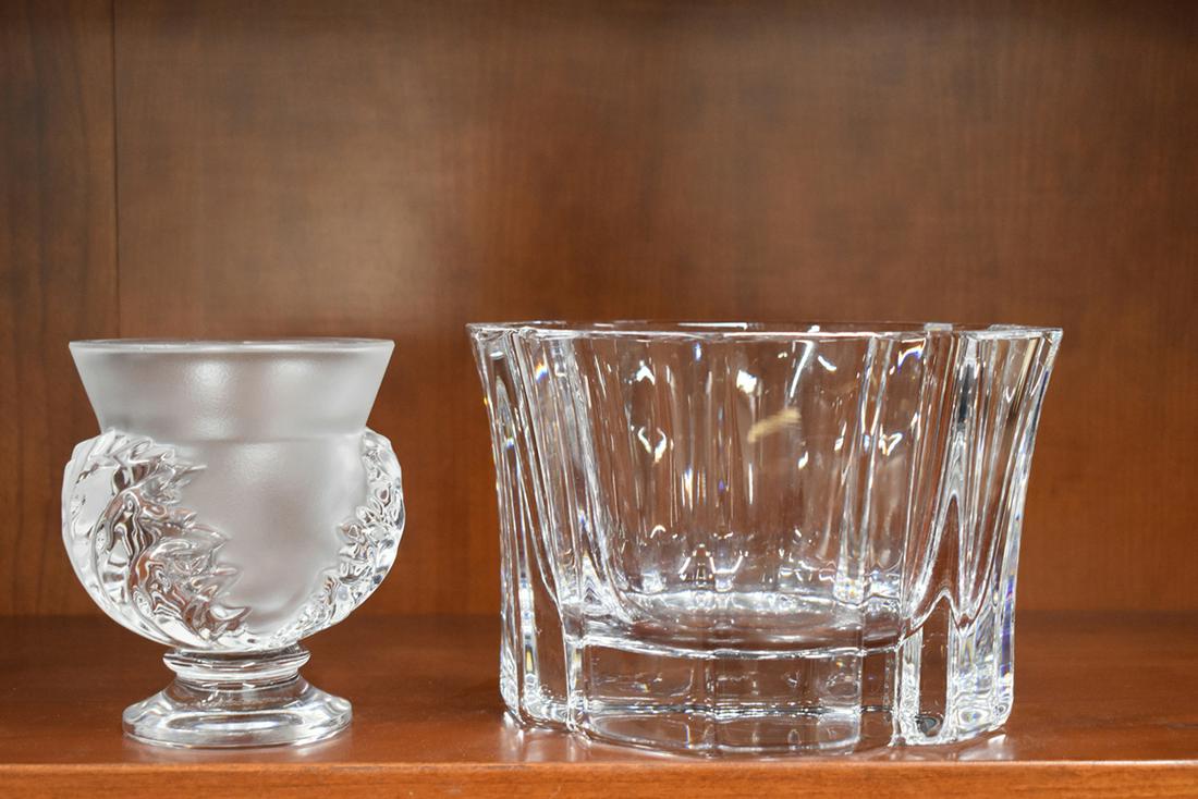 Lalique and Orrefors Colorless Glass Vases: Lalique and Orrefors Colorless Glass Vases, the Lalique having Urn form and foliate design around frosted glass, signed at bottom. The Orrefors having oval and angled design, signed at bottom and numb
