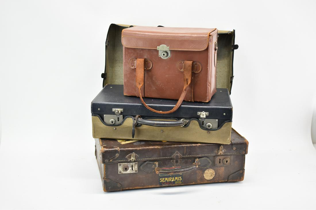 Three Vintage Traveling Suitcases: Three Vintage Traveling Suitcases. Used condition, wear, worn.