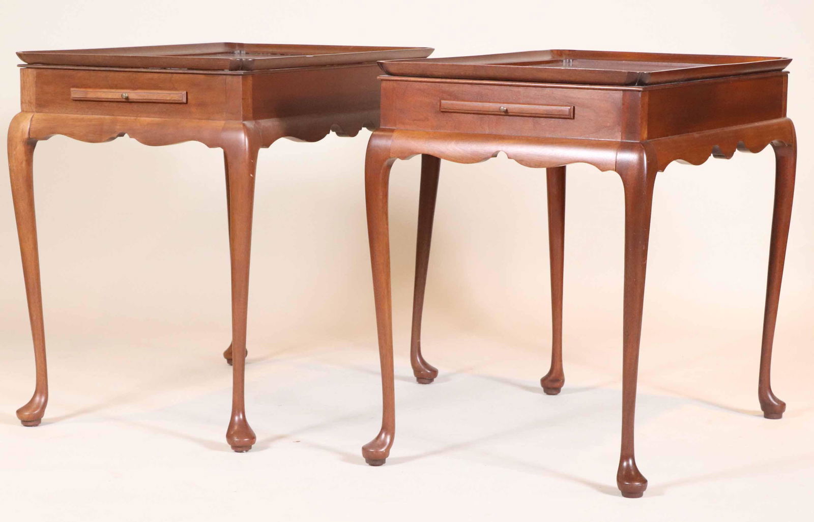 Pair of Queen Anne Style Mahogany Tea Tables: 20th C., with two slides. The bottom stamped "The Bartley Collection, Ltd." 27-1/2"h x 31"w x 20"d